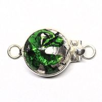 Emerald and silver clasp